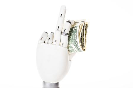 close-up view of robotic arm holding dollar banknotes isolated on whiteの写真素材