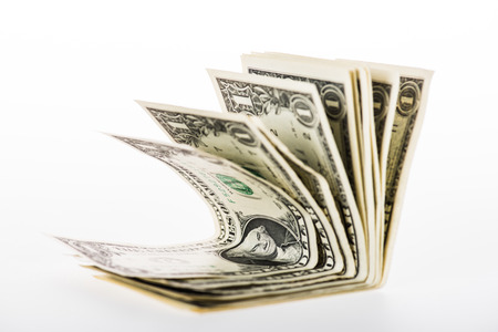 close-up view of dollar banknotes isolated on whiteの写真素材