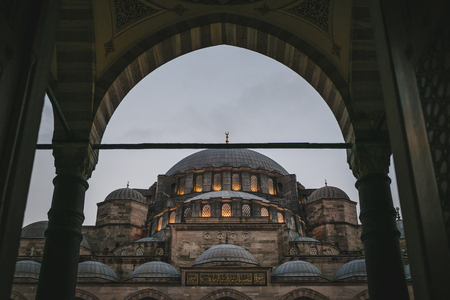 view through arch on suleymaniye mosque in evening in Istanbul, Turkeyの写真素材
