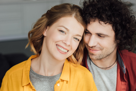 portrait of beautiful happy young couple at homeの写真素材