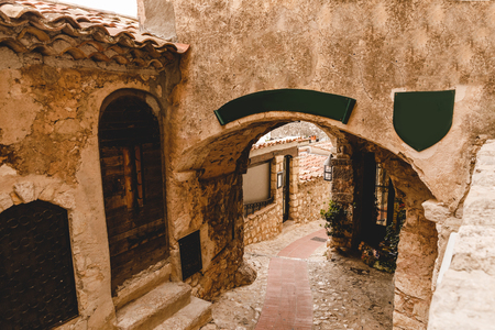 arch and ancient grungy buildings at old town, Eze, Franceの写真素材