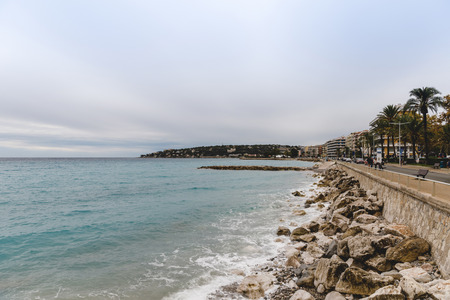 MENTON, FRANCE - 17 SEPTEMBER 2017: rocky coast of small city on cloudy day, Menton, Franceのeditorial素材