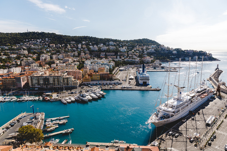 NICE, FRANCE - 17 SEPTEMBER 2017: harbour of old european city located on seashore on sunny summer dayのeditorial素材