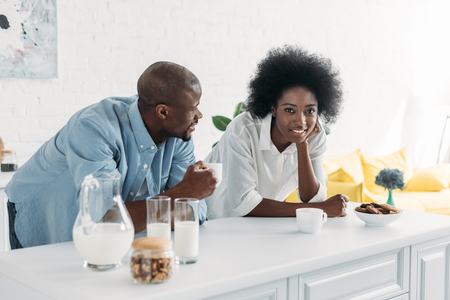 portrait of african american couple in morning in kitchen at homeの写真素材