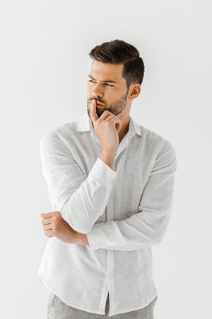 thoughtful man in linen white shirt isolated on grey backgroundの写真素材