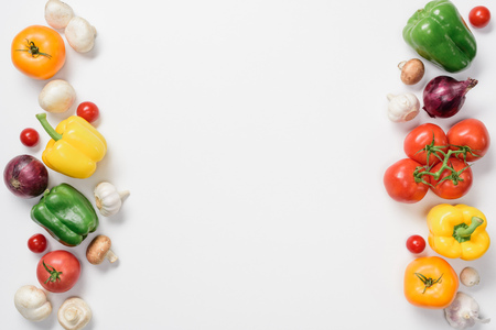 top view of ripe bell peppers, onions and mushrooms isolated on whiteの写真素材