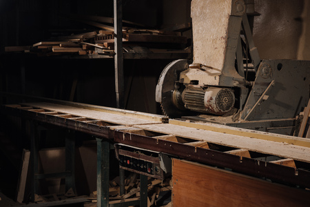 close up view of circular saw and materials at wooden workshopの写真素材