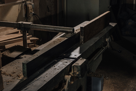 close up view of woodworkers workplace with equipment and wood at workshopの写真素材