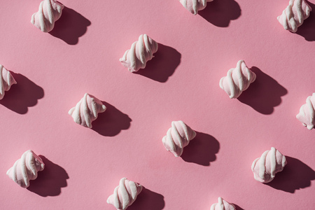collection of delicious marshmallows with shadows on pinkの写真素材