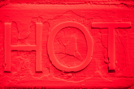 hot symbol on red neon flour backgroundの写真素材