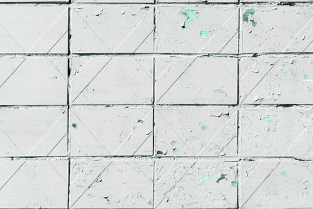 close-up view of old white weathered wall textured backgroundの写真素材