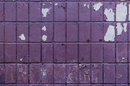 old weathered violet brick wall backgroundの写真素材