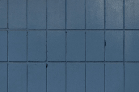 dark blue old wall with painted bricks, full frame background