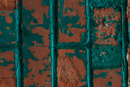 close-up view of old weathered brick wall with cracks