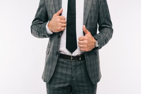 cropped image of businessman holding jacket isolated on whiteの写真素材