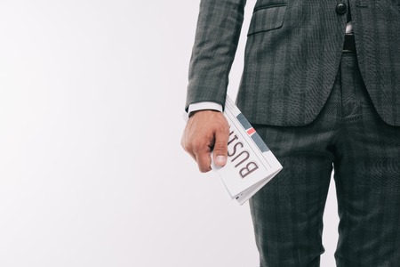 cropped image of businessman holding business newspaper isolated on white