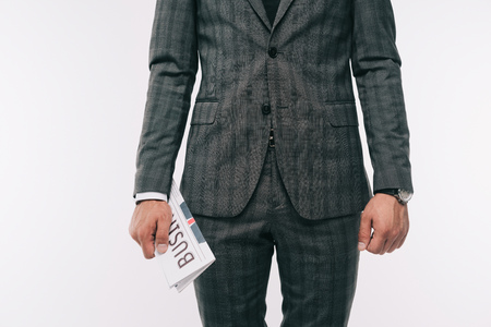 cropped image of businessman holding newspaper isolated on whiteの写真素材