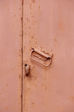 close up view of grungy metal door as backdropの写真素材