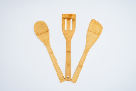 top view of set of wooden kitchen utensils isolated on greyの写真素材