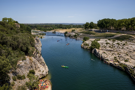 PROVENCE, FRANCE - JUNE 18, 2018: people swimming on boats on calm river in provence, franceのeditorial素材