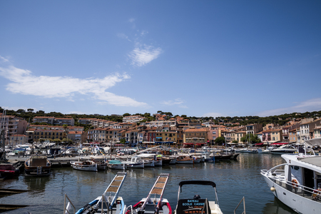 AVIGNON, FRANCE - JUNE 18, 2018: yachts and boats in harbor and traditional houses in Avignon,...
