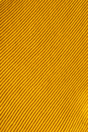 full frame of yellow woolen fabric backdropの写真素材