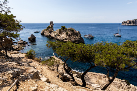 beautiful cliffs, calm sea and boats in harbour, Calanques de Marseille (Massif des Calanques), provence, franceの写真素材