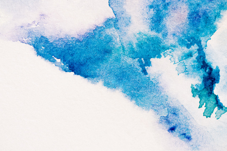 abstract painting with blue watercolor paint on white backgroundの写真素材