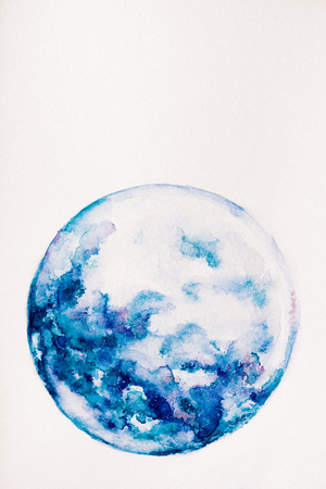 planet made of blue watercolor paint on white backgroundの写真素材
