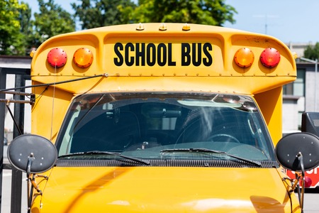 front view of school bus with inscription over front glass