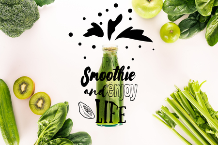 flat lay with detox drink and various organic food isolated on white with "drink smoothie and enjoy life" inspirationの写真素材