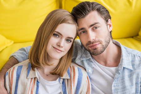 portrait of young man embracing attractive girlfriendの写真素材