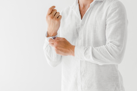 cropped image of man in linen white shirt isolated on grey backgroundの写真素材