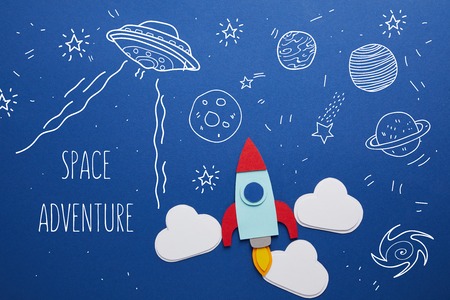 clouds and rocket on blue background with universe icons and "space adventure" inspirationの写真素材