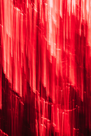 beautiful red vertical illuminated stripes, abstract backgroundの写真素材