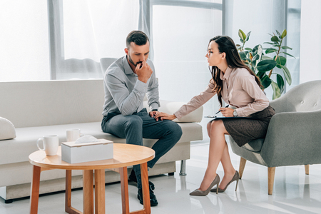 female psychologist and patient having consultation in officeの写真素材