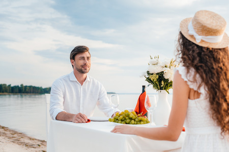 young beautiful couple on romantic date on beachの写真素材