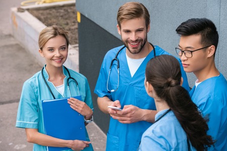 high angle view of multicultural medical students standing near medical universityの写真素材