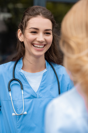 smiling medical student talking with lecturerの写真素材
