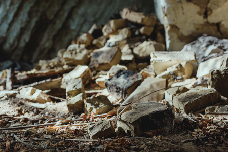 abandoned building with scattered damaged bricks on floorの写真素材
