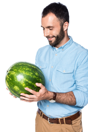 man with green watermelon isolated on whiteの写真素材