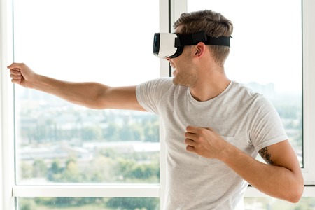 young man in vr headset at home