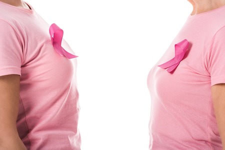 partial side view of women with pink ribbons isolated on white, breast cancer awareness conceptの写真素材