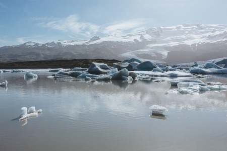 scenic shot of melting glacier ice floating in lake in Fjallsarlon, Iceland