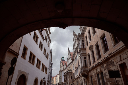 arch and street with old historical buildings in Dresden, Germanyの写真素材
