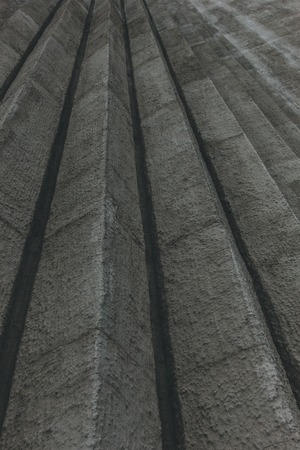 bottom view of vertical edges on concrete wall