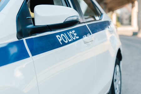 selective focus of automobile with lettering police at city streetの写真素材