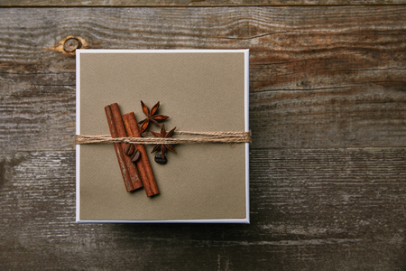 top view of box decorated with spices on rustic wooden tableの写真素材