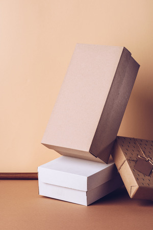 shoes boxes and gift on beige in studioの写真素材