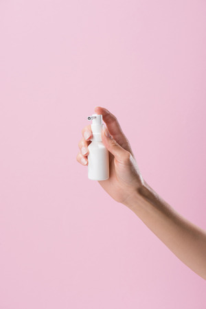 cropped shot of woman holding medical spray isolated on pinkの写真素材